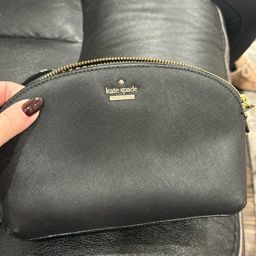 Authentic Kate spade black and gold crossbody  bag worn few times